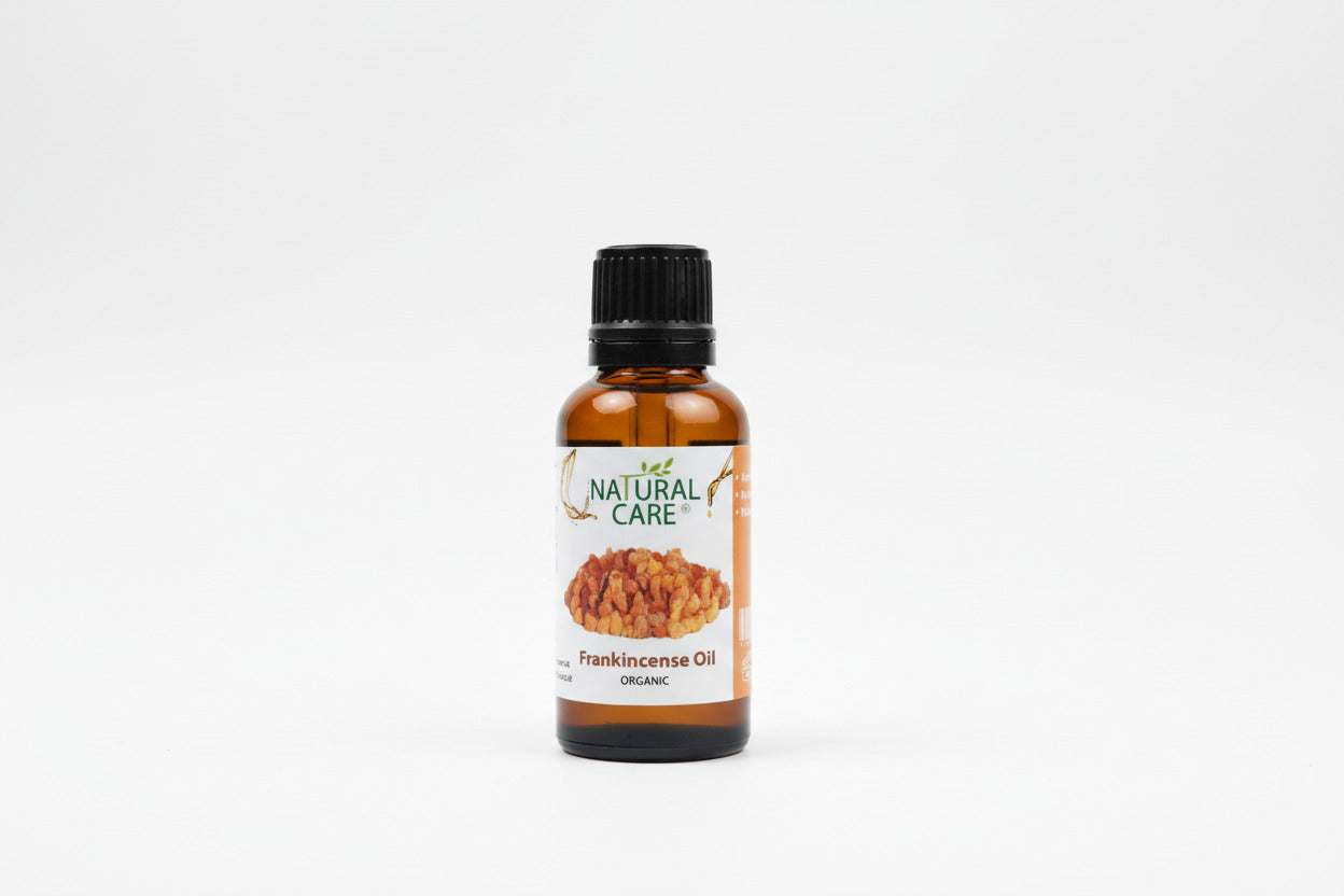 Bottle of Natural Care Frankincense Oil on a light background