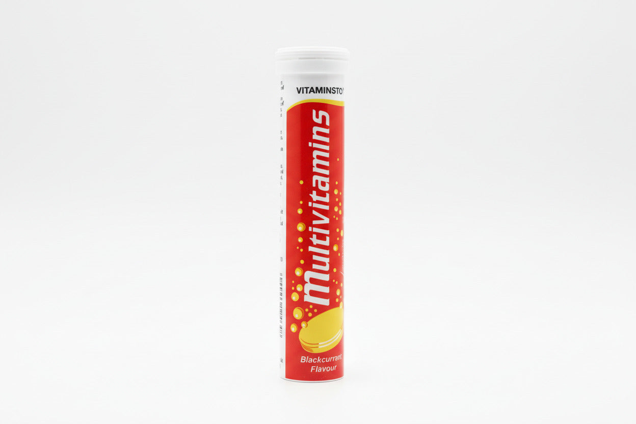 Multivitamins tube on a light gray background