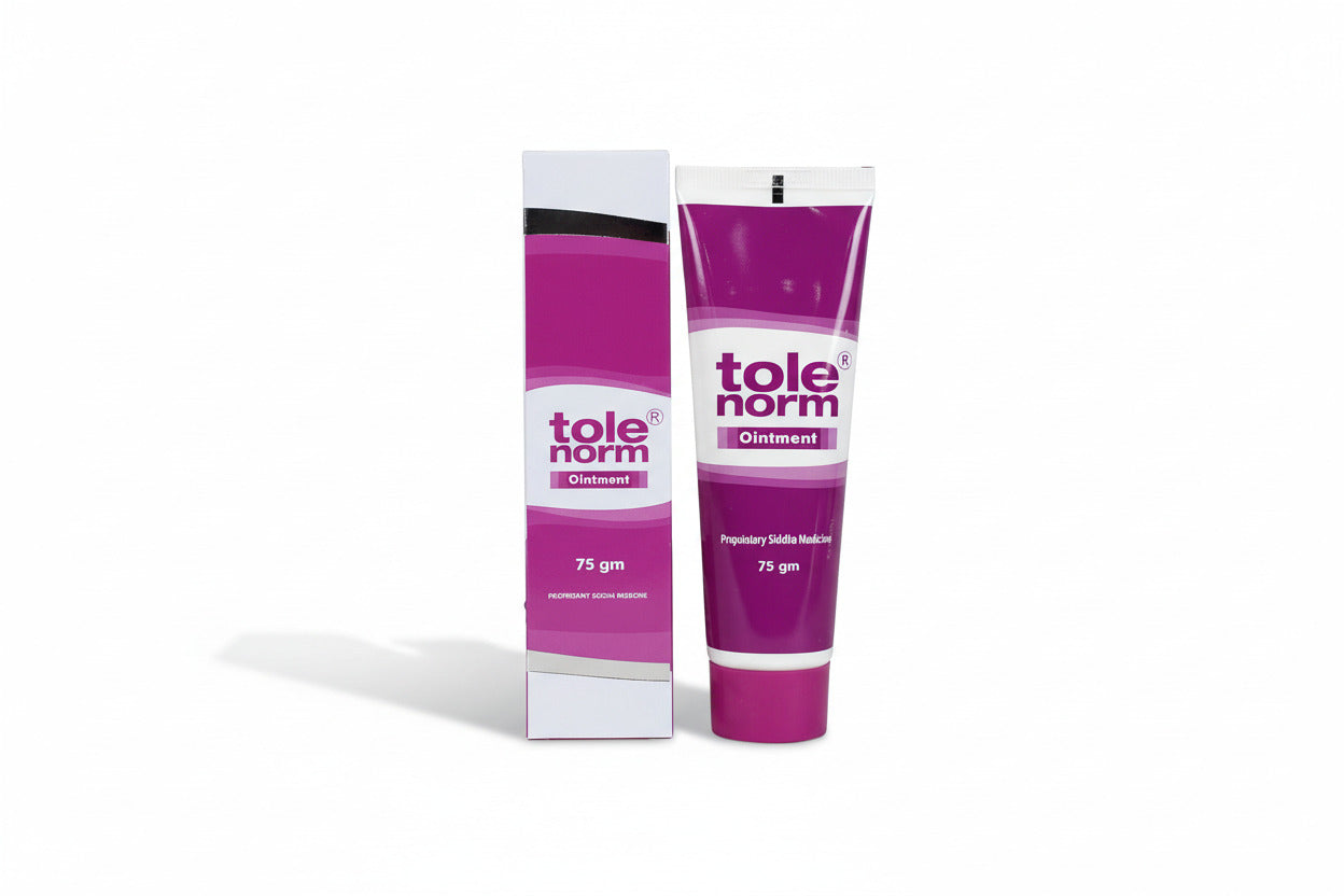 Tole Norm ointment tube and box on a pink background