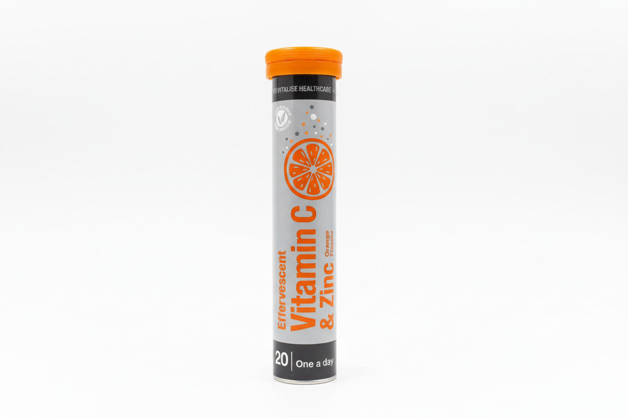 Vitamin C and Zinc supplement tube on a light gray background