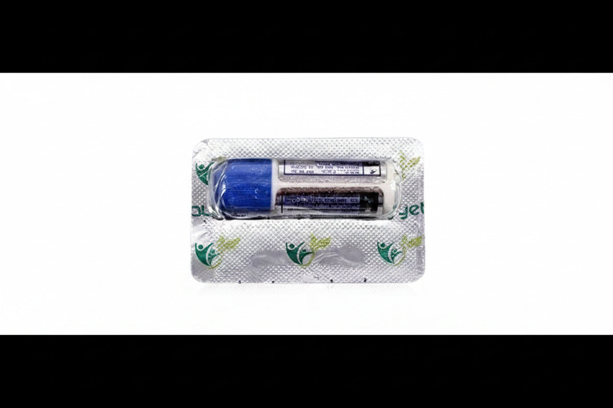 Two small cylindrical batteries in a clear plastic blister pack with a white backing card printed with green leaf motifs, shown on a plain white background.