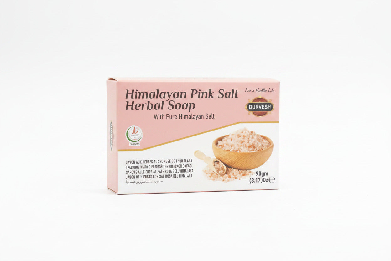 Packaging of Himalayan Pink Salt Herbal Soap with visible branding on a wooden surface.