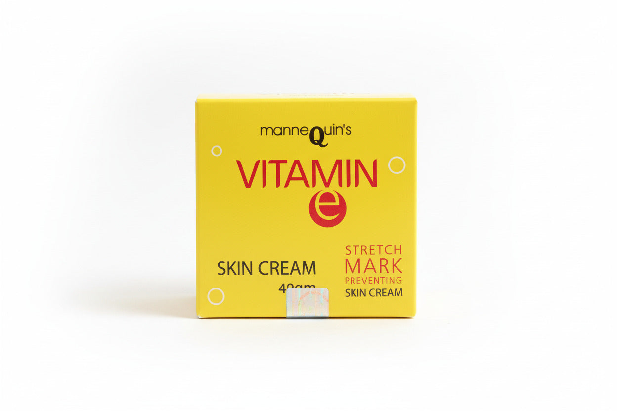 Yellow box of Mannequin's Vitamin E skin cream on a wooden surface
