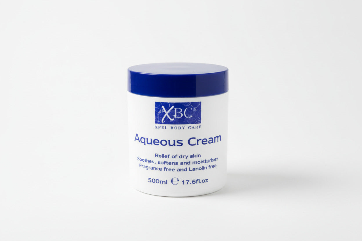 Xpel Body Care Aqueous Cream jar on a wooden surface