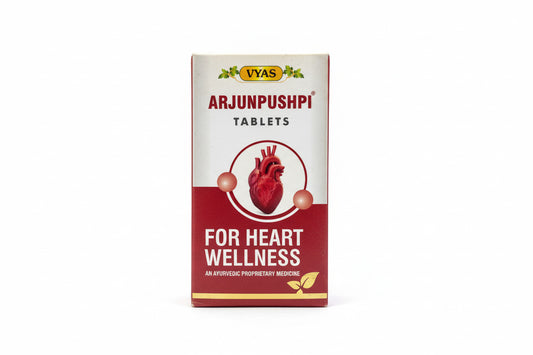 Box of Arjunpushpi tablets for heart wellness on a wooden surface