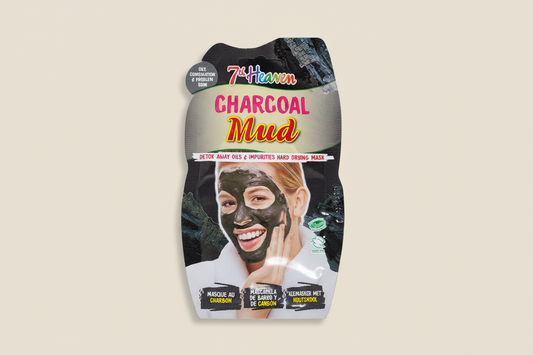 Packaging of 7th Heaven Charcoal Mud mask with a woman applying the mask.