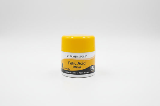 Yellow and white container of Vitaminstore Folic Acid 400εg on a light gray background