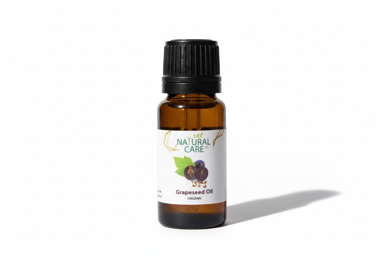 Bottle of Natural Care Grapeseed Oil on a light gray background