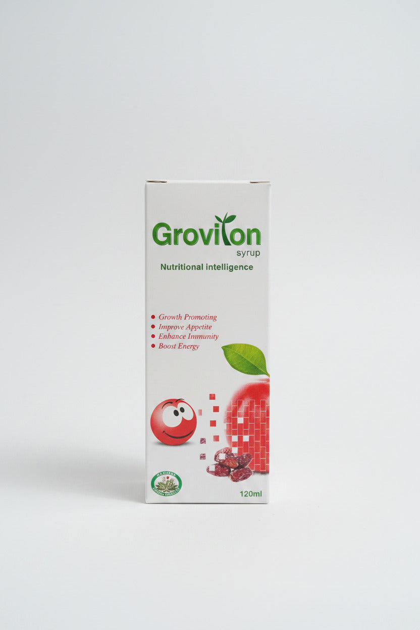 Grovlon syrup packaging on a wooden surface with a keyboard in the background