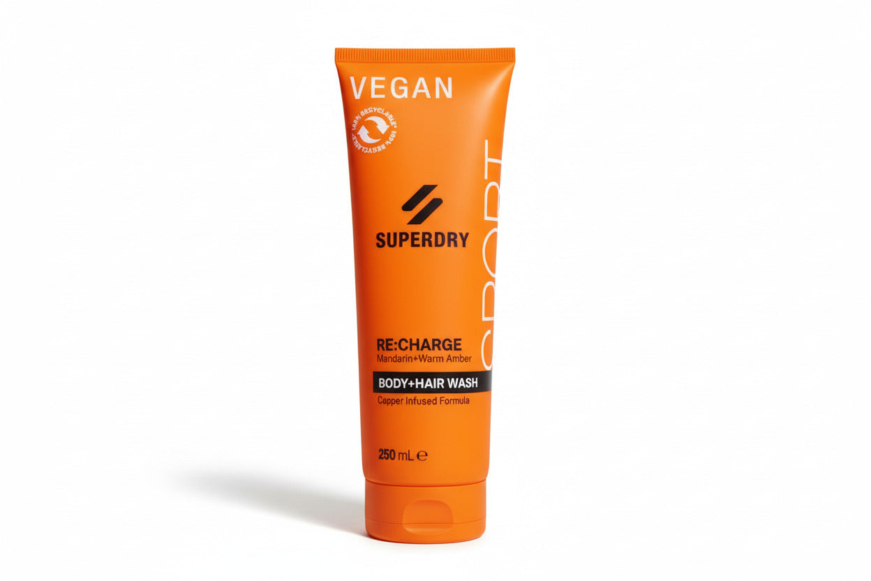 Superdry body and hair wash tube on a white surface