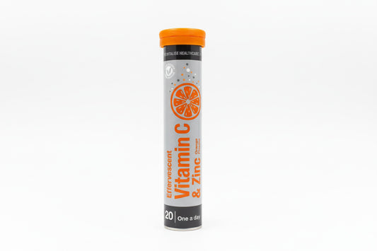 Vitamin C and Zinc supplement tube on a light gray background