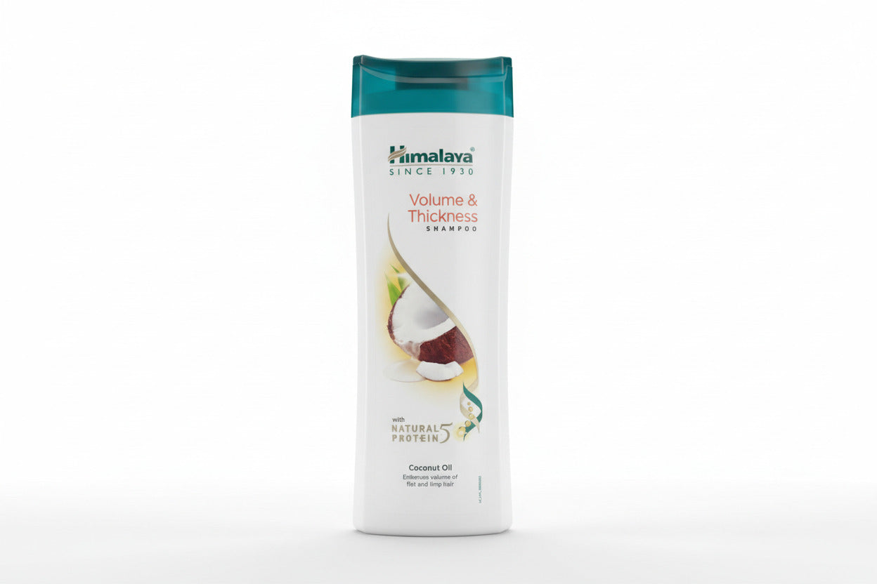 Himalaya Volume & Thickness Shampoo bottle on a wooden surface