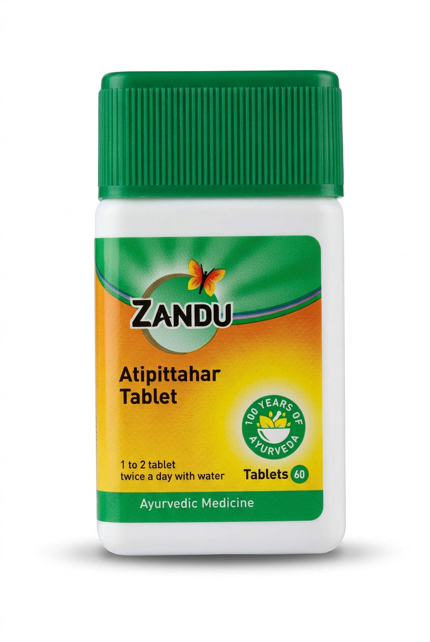 Zandu Atipittahar Tablet bottle, an ayurvedic medicine, featuring a green and yellow label on a white container.
