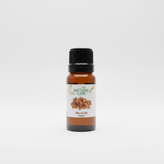 Bottle of Natural Care Myrrh Oil on a light gray background