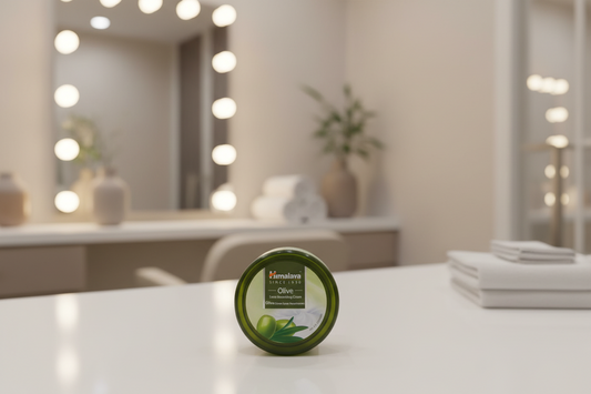 Himalaya Olive Extra Nourishing Cream jar on a wooden surface
