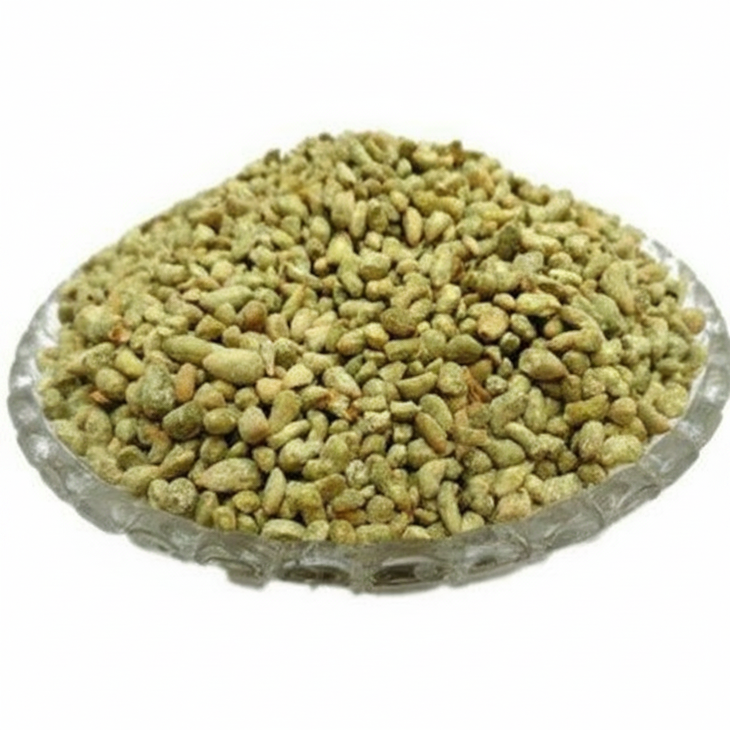 Greenish-brown seeds in a glass bowl on a white background