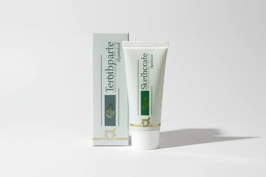 Tube of cream with a green label on a white background