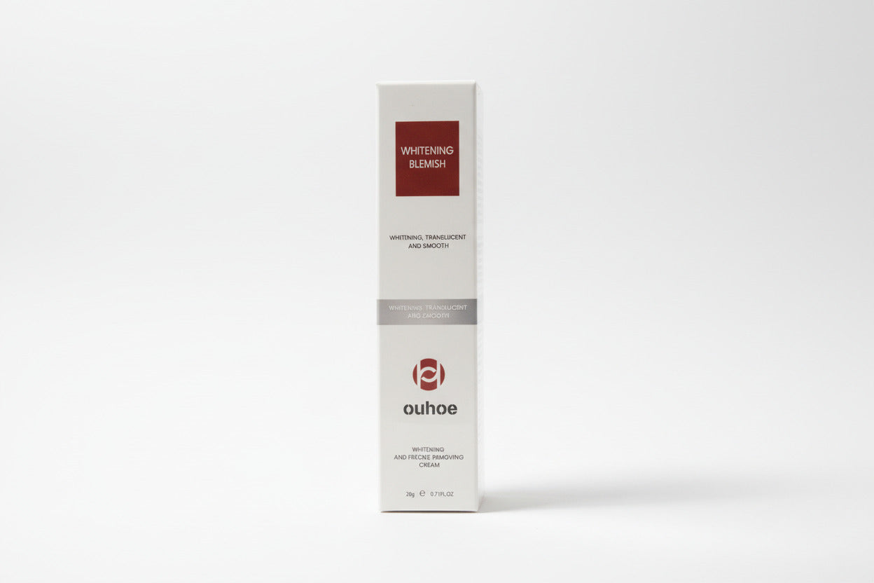 Ouhoe whitening blemish cream packaging with a scenic background
