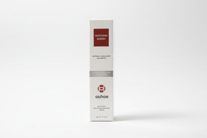 Ouhoe whitening blemish cream packaging with a scenic background